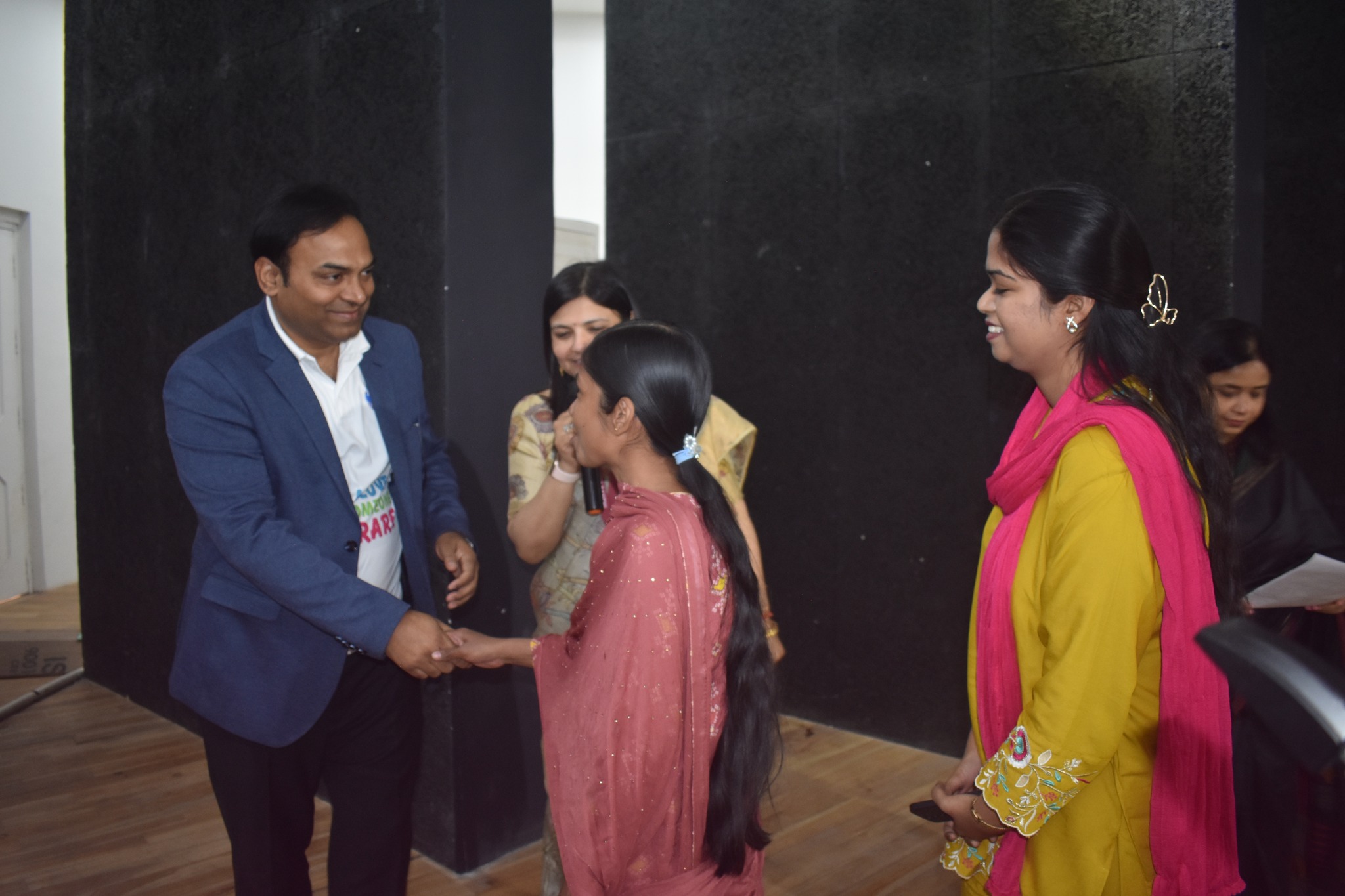 A doctor explaining a medical chart to an attendee.